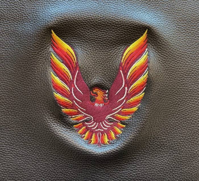 Full color Firebird emblem embroidered into a leather seat panel